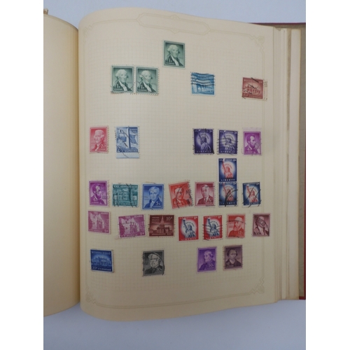 7045 - A worldwide stamp collection in four albums including 1 album of  GB with early phosphor sets, one a...