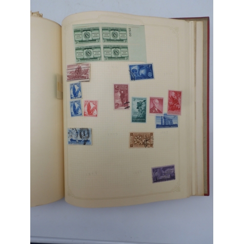 7045 - A worldwide stamp collection in four albums including 1 album of  GB with early phosphor sets, one a... 