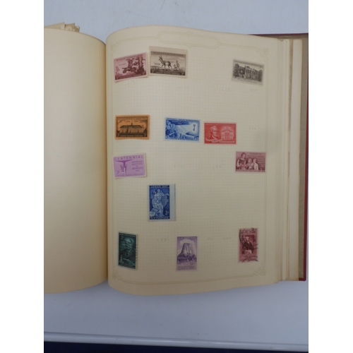 7045 - A worldwide stamp collection in four albums including 1 album of  GB with early phosphor sets, one a... 