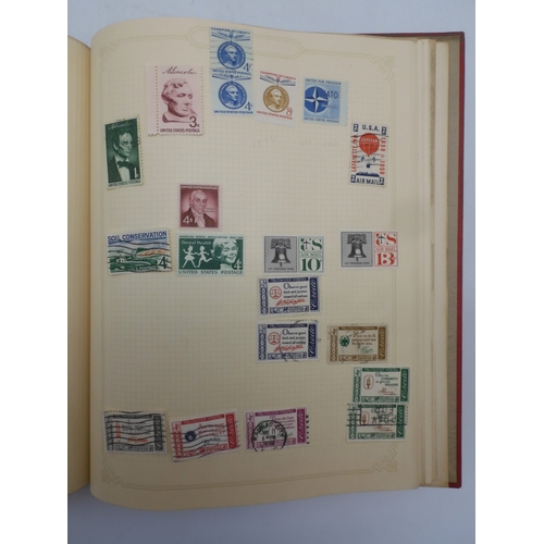 7045 - A worldwide stamp collection in four albums including 1 album of  GB with early phosphor sets, one a... 