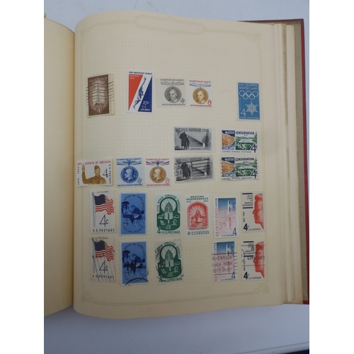 7045 - A worldwide stamp collection in four albums including 1 album of  GB with early phosphor sets, one a... 