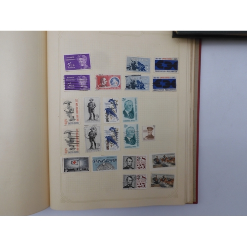 7045 - A worldwide stamp collection in four albums including 1 album of  GB with early phosphor sets, one a... 