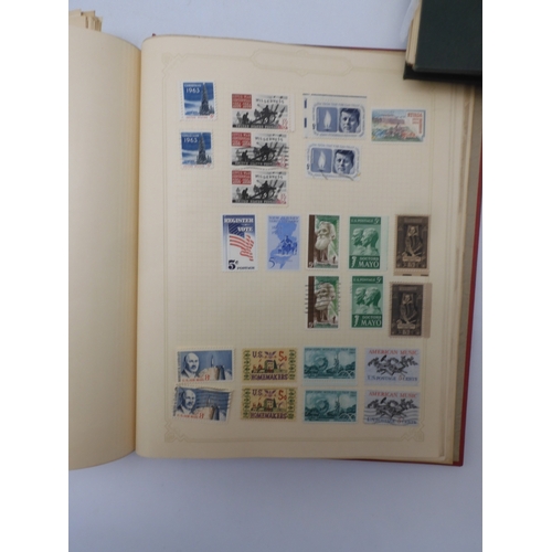 7045 - A worldwide stamp collection in four albums including 1 album of  GB with early phosphor sets, one a... 