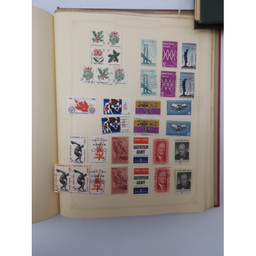 7045 - A worldwide stamp collection in four albums including 1 album of  GB with early phosphor sets, one a...