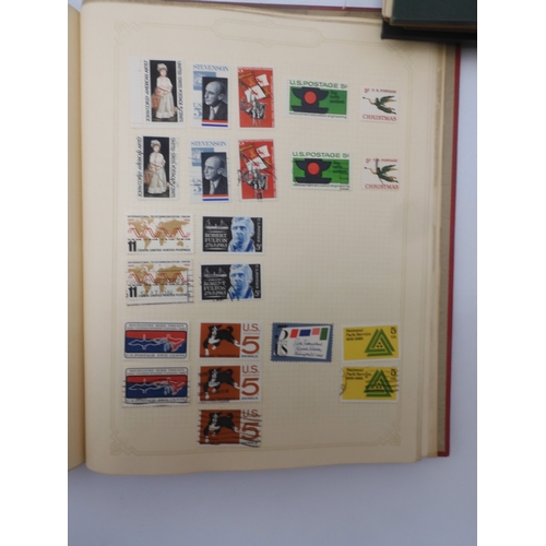 7045 - A worldwide stamp collection in four albums including 1 album of  GB with early phosphor sets, one a...