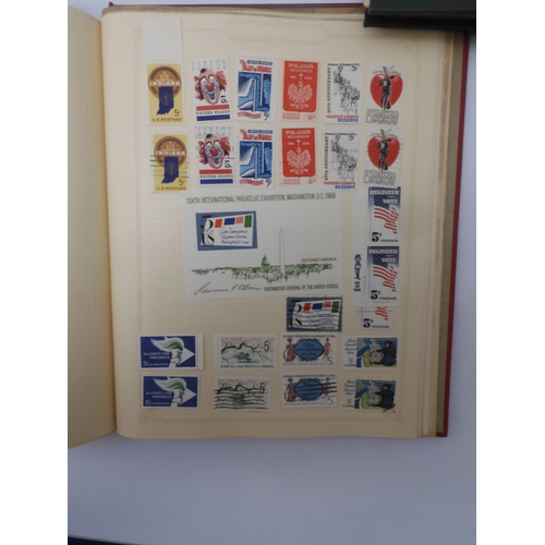 7045 - A worldwide stamp collection in four albums including 1 album of  GB with early phosphor sets, one a... 