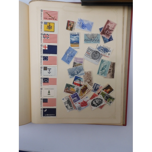 7045 - A worldwide stamp collection in four albums including 1 album of  GB with early phosphor sets, one a...