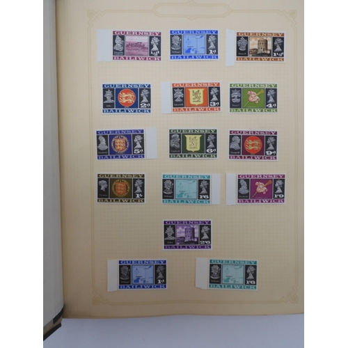 7045 - A worldwide stamp collection in four albums including 1 album of  GB with early phosphor sets, one a...