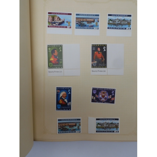 7045 - A worldwide stamp collection in four albums including 1 album of  GB with early phosphor sets, one a... 