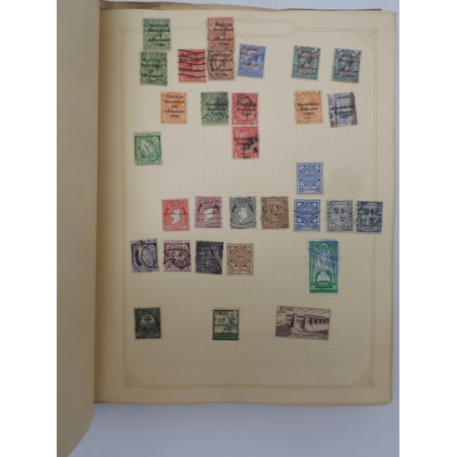 7045 - A worldwide stamp collection in four albums including 1 album of  GB with early phosphor sets, one a... 