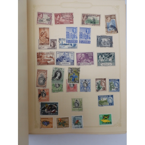 7045 - A worldwide stamp collection in four albums including 1 album of  GB with early phosphor sets, one a... 