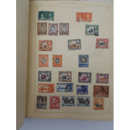 7045 - A worldwide stamp collection in four albums including 1 album of  GB with early phosphor sets, one a... 