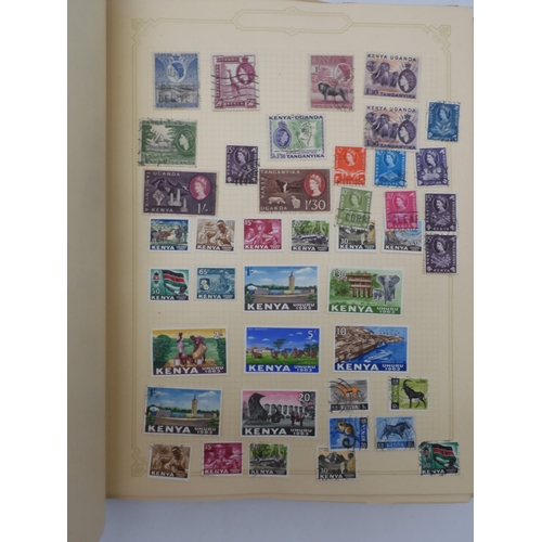 7045 - A worldwide stamp collection in four albums including 1 album of  GB with early phosphor sets, one a...