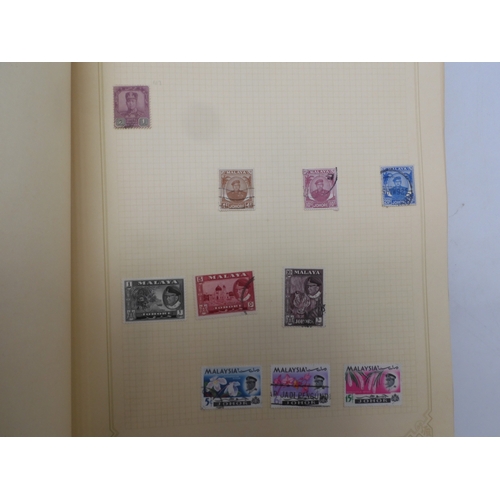 7045 - A worldwide stamp collection in four albums including 1 album of  GB with early phosphor sets, one a... 