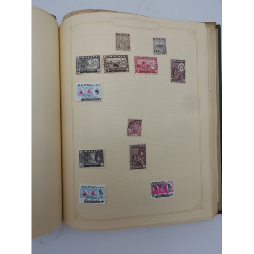 7045 - A worldwide stamp collection in four albums including 1 album of  GB with early phosphor sets, one a... 