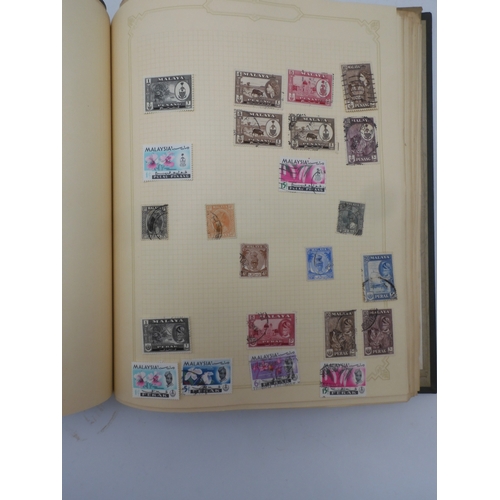 7045 - A worldwide stamp collection in four albums including 1 album of  GB with early phosphor sets, one a... 