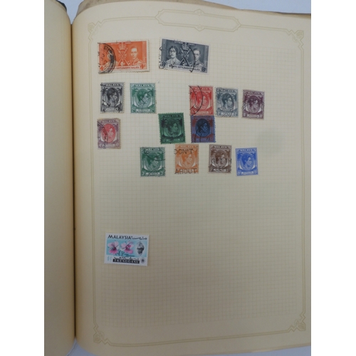 7045 - A worldwide stamp collection in four albums including 1 album of  GB with early phosphor sets, one a... 