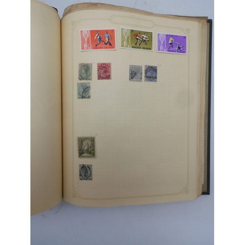 7045 - A worldwide stamp collection in four albums including 1 album of  GB with early phosphor sets, one a...