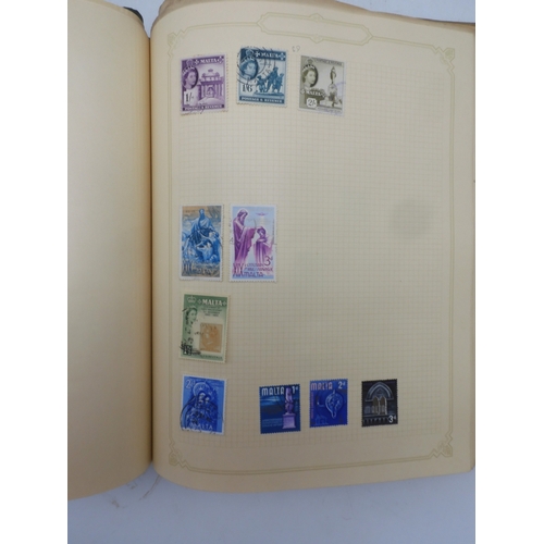 7045 - A worldwide stamp collection in four albums including 1 album of  GB with early phosphor sets, one a...