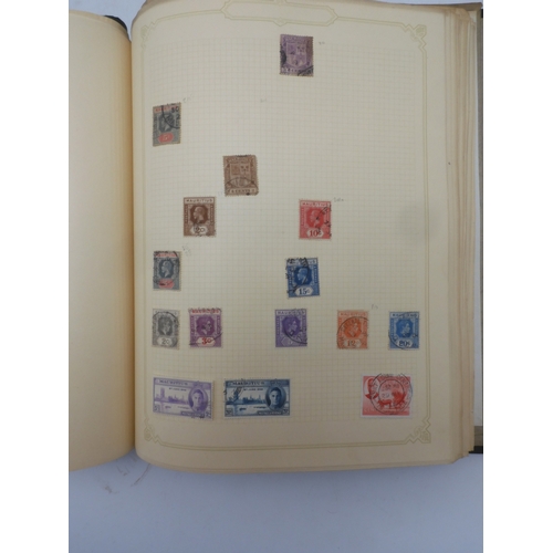 7045 - A worldwide stamp collection in four albums including 1 album of  GB with early phosphor sets, one a... 