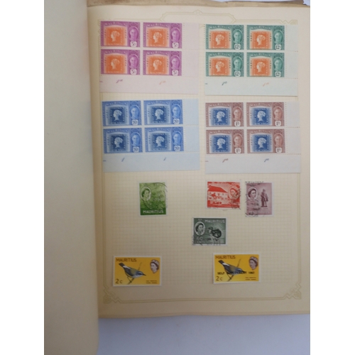 7045 - A worldwide stamp collection in four albums including 1 album of  GB with early phosphor sets, one a...