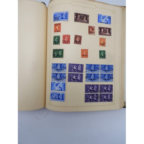 7045 - A worldwide stamp collection in four albums including 1 album of  GB with early phosphor sets, one a...