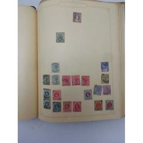 7045 - A worldwide stamp collection in four albums including 1 album of  GB with early phosphor sets, one a...