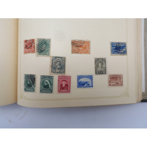 7045 - A worldwide stamp collection in four albums including 1 album of  GB with early phosphor sets, one a...