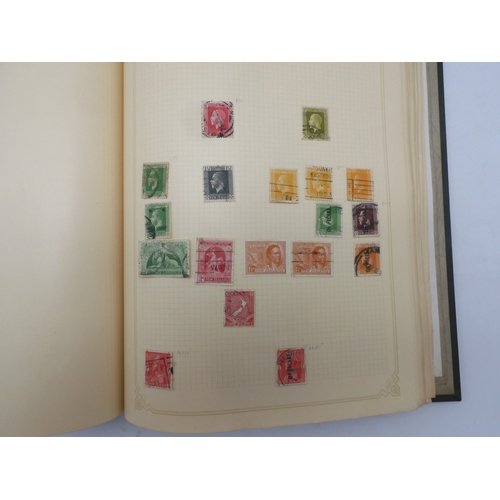 7045 - A worldwide stamp collection in four albums including 1 album of  GB with early phosphor sets, one a...