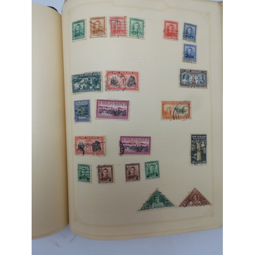 7045 - A worldwide stamp collection in four albums including 1 album of  GB with early phosphor sets, one a... 