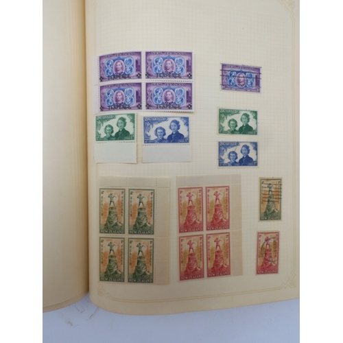 7045 - A worldwide stamp collection in four albums including 1 album of  GB with early phosphor sets, one a... 