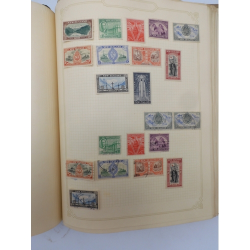 7045 - A worldwide stamp collection in four albums including 1 album of  GB with early phosphor sets, one a...