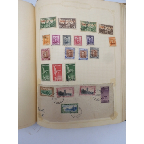 7045 - A worldwide stamp collection in four albums including 1 album of  GB with early phosphor sets, one a...