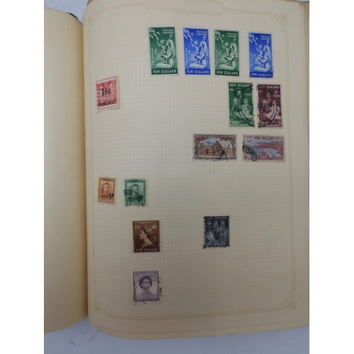 7045 - A worldwide stamp collection in four albums including 1 album of  GB with early phosphor sets, one a...