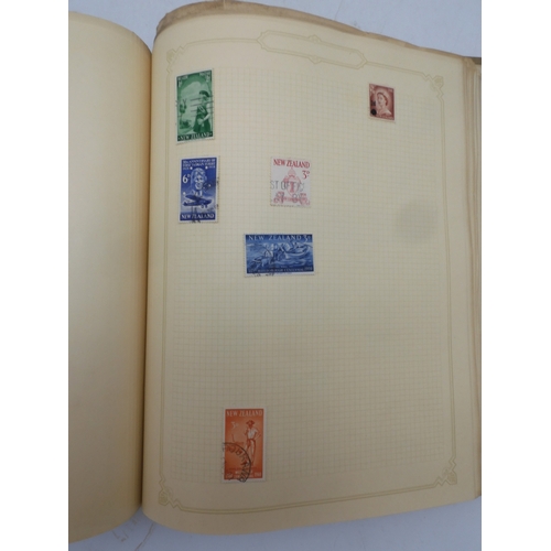 7045 - A worldwide stamp collection in four albums including 1 album of  GB with early phosphor sets, one a...