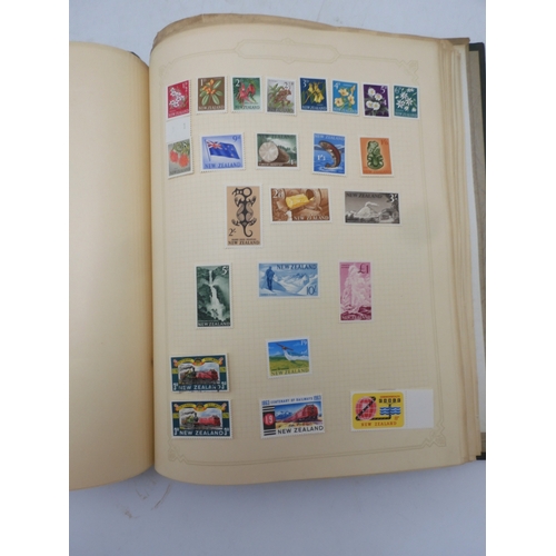 7045 - A worldwide stamp collection in four albums including 1 album of  GB with early phosphor sets, one a... 