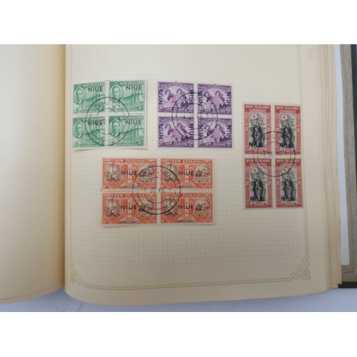 7045 - A worldwide stamp collection in four albums including 1 album of  GB with early phosphor sets, one a... 