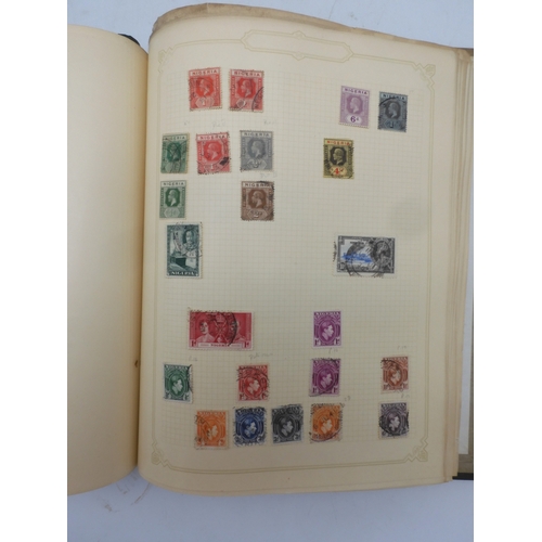 7045 - A worldwide stamp collection in four albums including 1 album of  GB with early phosphor sets, one a... 