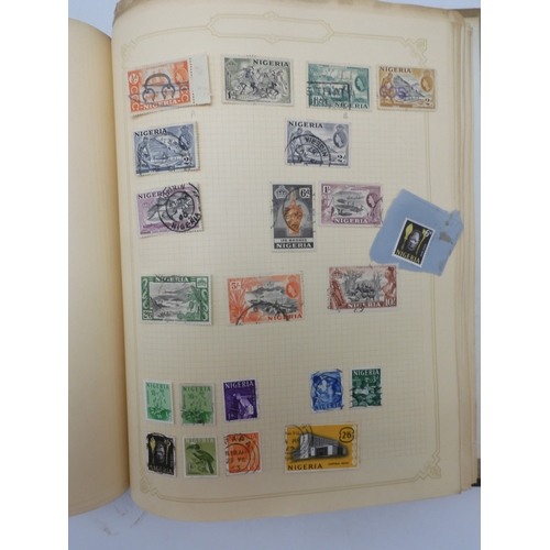 7045 - A worldwide stamp collection in four albums including 1 album of  GB with early phosphor sets, one a... 