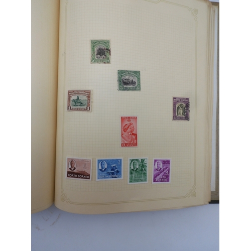 7045 - A worldwide stamp collection in four albums including 1 album of  GB with early phosphor sets, one a... 