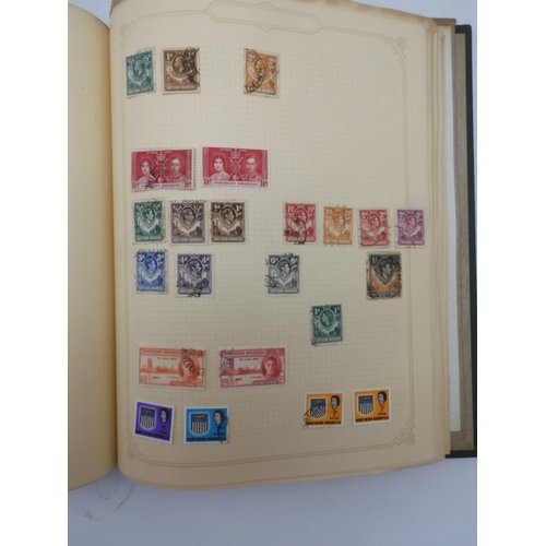 7045 - A worldwide stamp collection in four albums including 1 album of  GB with early phosphor sets, one a... 