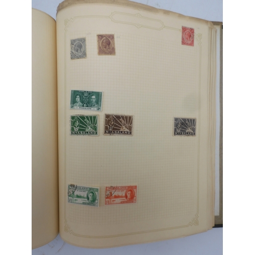 7045 - A worldwide stamp collection in four albums including 1 album of  GB with early phosphor sets, one a... 