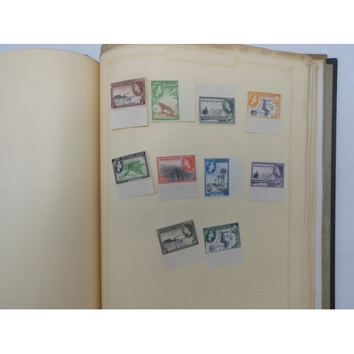 7045 - A worldwide stamp collection in four albums including 1 album of  GB with early phosphor sets, one a... 