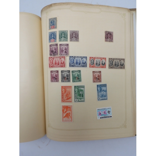 7045 - A worldwide stamp collection in four albums including 1 album of  GB with early phosphor sets, one a... 