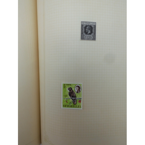 7045 - A worldwide stamp collection in four albums including 1 album of  GB with early phosphor sets, one a... 