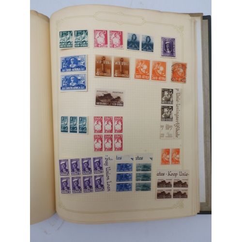 7045 - A worldwide stamp collection in four albums including 1 album of  GB with early phosphor sets, one a...