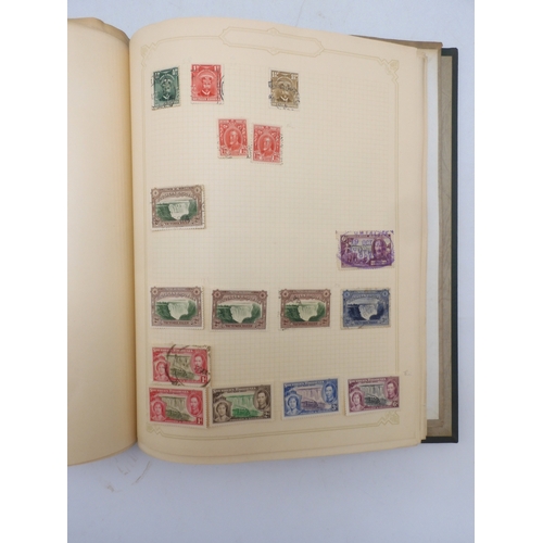 7045 - A worldwide stamp collection in four albums including 1 album of  GB with early phosphor sets, one a...