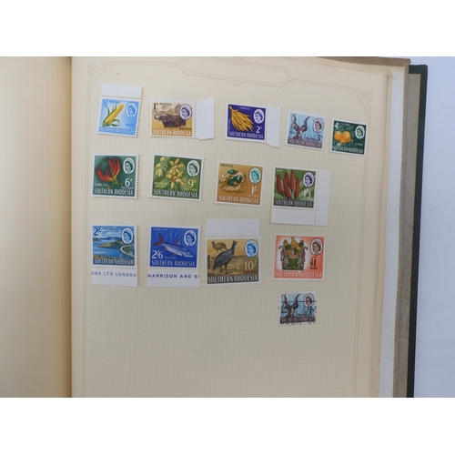 7045 - A worldwide stamp collection in four albums including 1 album of  GB with early phosphor sets, one a... 