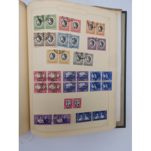 7045 - A worldwide stamp collection in four albums including 1 album of  GB with early phosphor sets, one a...