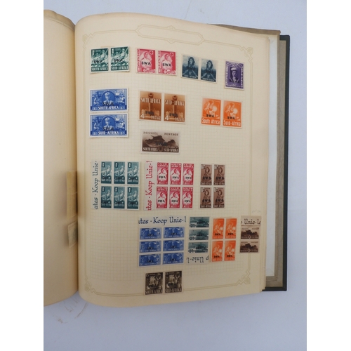 7045 - A worldwide stamp collection in four albums including 1 album of  GB with early phosphor sets, one a... 